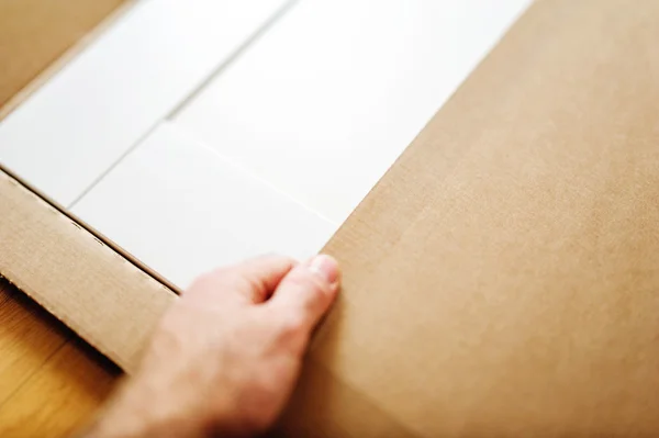 Man installing new white furniture — Stock Image Man installing new white furniture Stock Picture