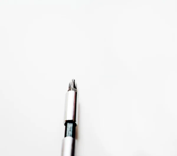 Close-up of screwdriver on a board — Stock Photo, Image