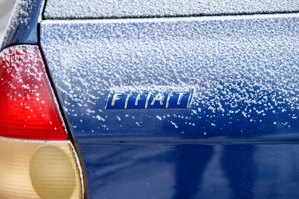 Fiat diesel car logo covered with snow — Stockfoto
