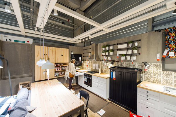 Woman choosing kitchen furniture