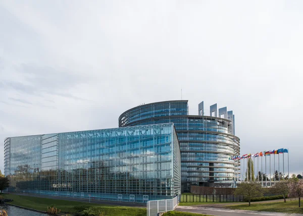 European Parliament headquarter with all flags waving — Stock Photo, Image