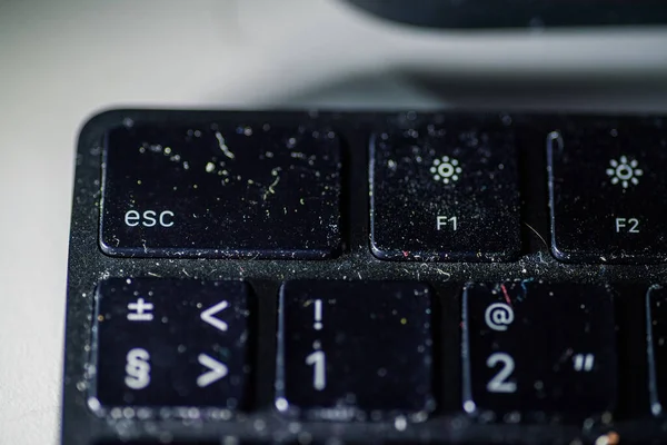 Dusty full with microbes and germs black keyboard risk of infection — Stock Photo, Image