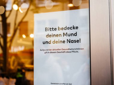 Almanya 'ya girmeden önce lütfen koruyucu maskeler takın.