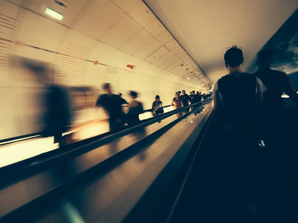 Living in paris - Long exposure of unrecognizable of commuters inside Parisian underground metro moving escalator walkway taking the fastest route — Stock Photo, Image