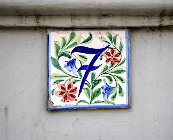 Beautiful painted number 7 on the house tile — Stock Photo, Image