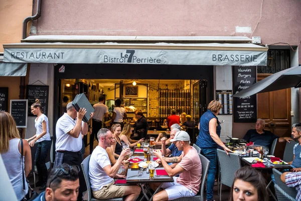 People eating drinking smoking at the Le 7 bistrot perriere brasserie pub in central Annecy — Stock Photo, Image