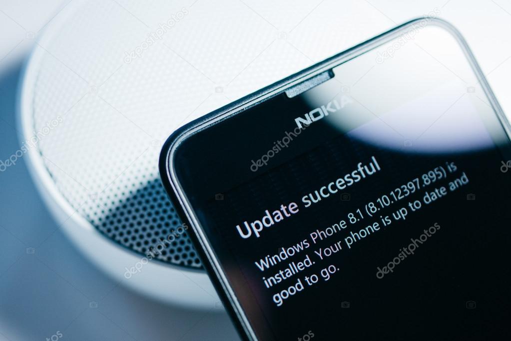 LONDON, UNITED KINGDOM - NOVEMBER 9, 2014: Nokia Lumia smartphone windowsphone with Update Successful to Windows 8.1 message on screen. Microsoft has announced that it will stop using Nokia branding on all future mobile phone