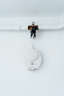 Gas carbon monoxide detector on a wall clipart
