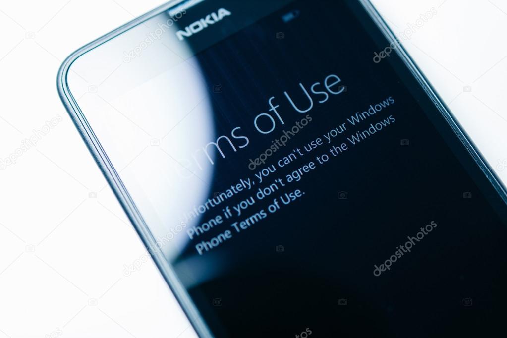 LONDON, UNITED KINGDOM - NOVEMBER 9, 2014: Nokia Lumia smartphone windowsphone featuring Terms Of Use on touchscreen display. Microsoft has announced that it will stop using Nokia branding on all future mobile phone