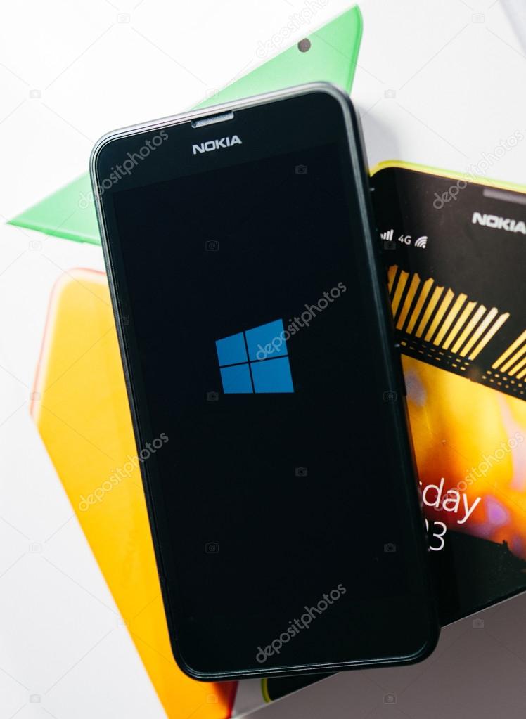 LONDON, UNITED KINGDOM - NOVEMBER 9, 2014: Nokia Lumia Microsoft Windowsphone smartphone with Windowsphone logo on screen. Microsoft has announced that it will stop using Nokia branding on all future mobile phone