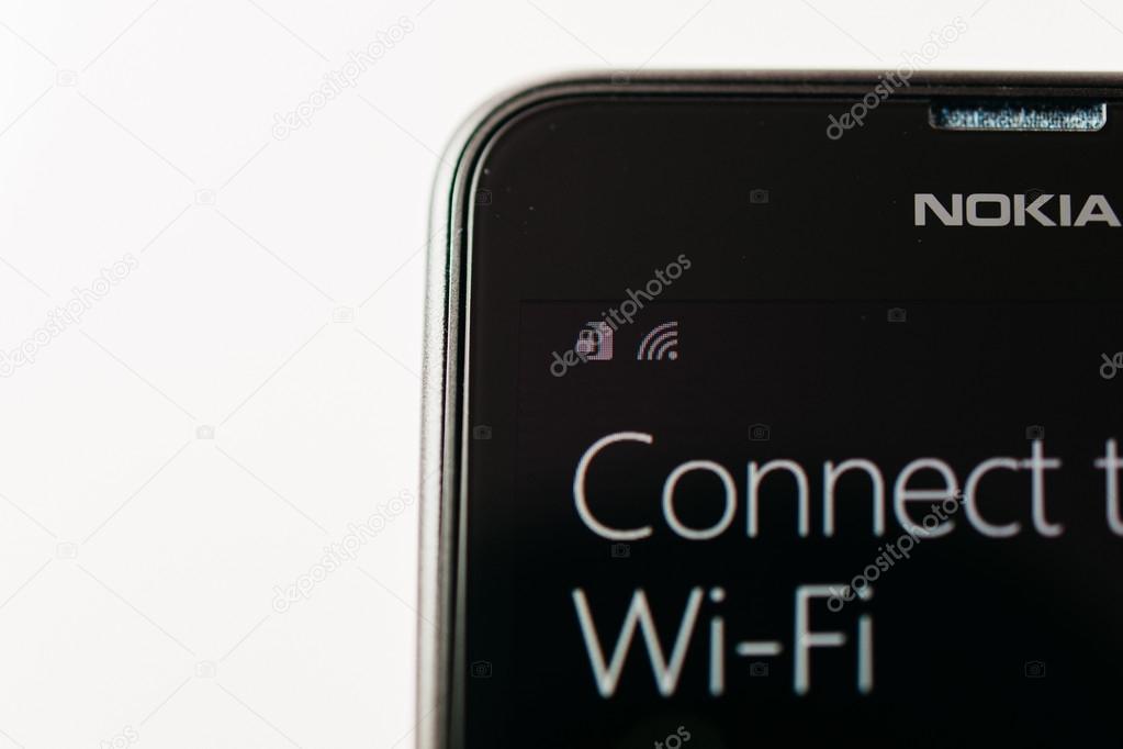 LONDON, UNITED KINGDOM - NOVEMBER 9, 2014: Nokia Lumia smartphone windowsphone with Connect to Wi-Fi message on display. Microsoft has announced that it will stop using Nokia branding on all future mobile phone
