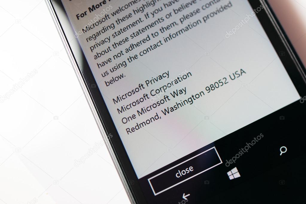 LONDON, UNITED KINGDOM - NOVEMBER 9, 2014: Nokia Lumia smartphone windowsphone displaying Microsoft Privacy address on phone display. Microsoft has announced that it will stop using Nokia branding on all future mobile phone