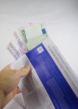 Hand holding Tax Free envelope