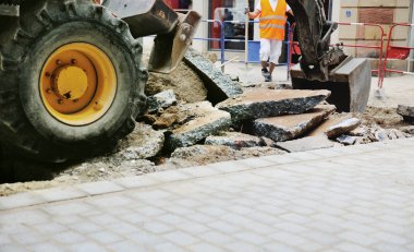 Tractor truck tire on a broken asphal