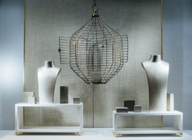 Jewelry store show-window with a dummy torso, an empty cage