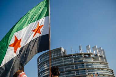 People denouncing the Syrian airstrikes on Douma 