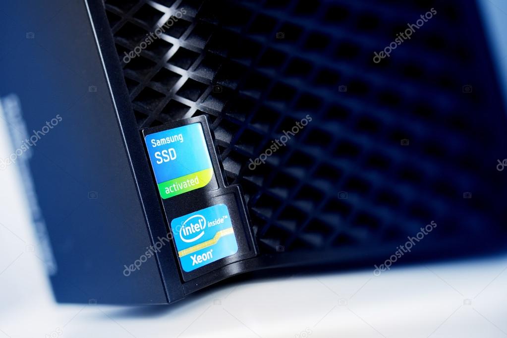 LONDON, UNITED KINGDOM - JUNE 30, 2014: Intel Xeon inside ans SSD Samsung Activated stickers on powerful workstation computer. Tilt-shift lens used