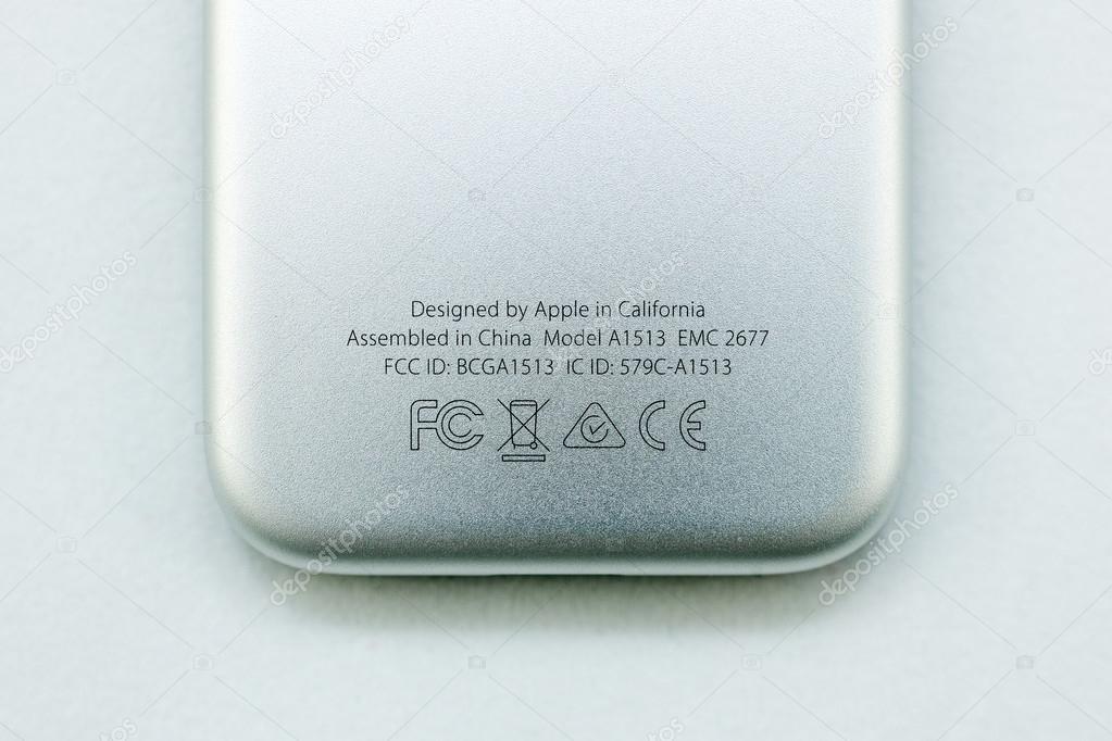PARIS, FRANCE - NOV 10, 2015: Extreme colseup of the bottom rear of the Apple TV media streaming  player microconsole by Apple Computers futuristic touch remote swipe-to-select with integrated Siri and motion sensor