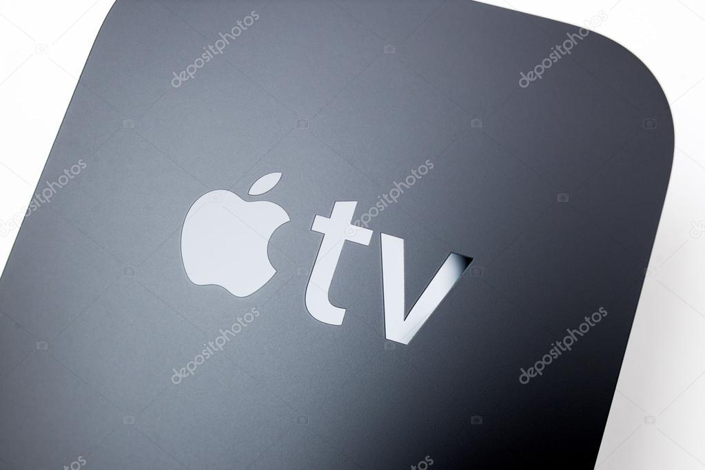 PARIS, FRANCE - NOV 10, 2015: Apple logo on the new Apple TV media streaming  player microconsole by Apple Computers featuring a new touch remote swipe-to-select with integrated Siri and motion senso