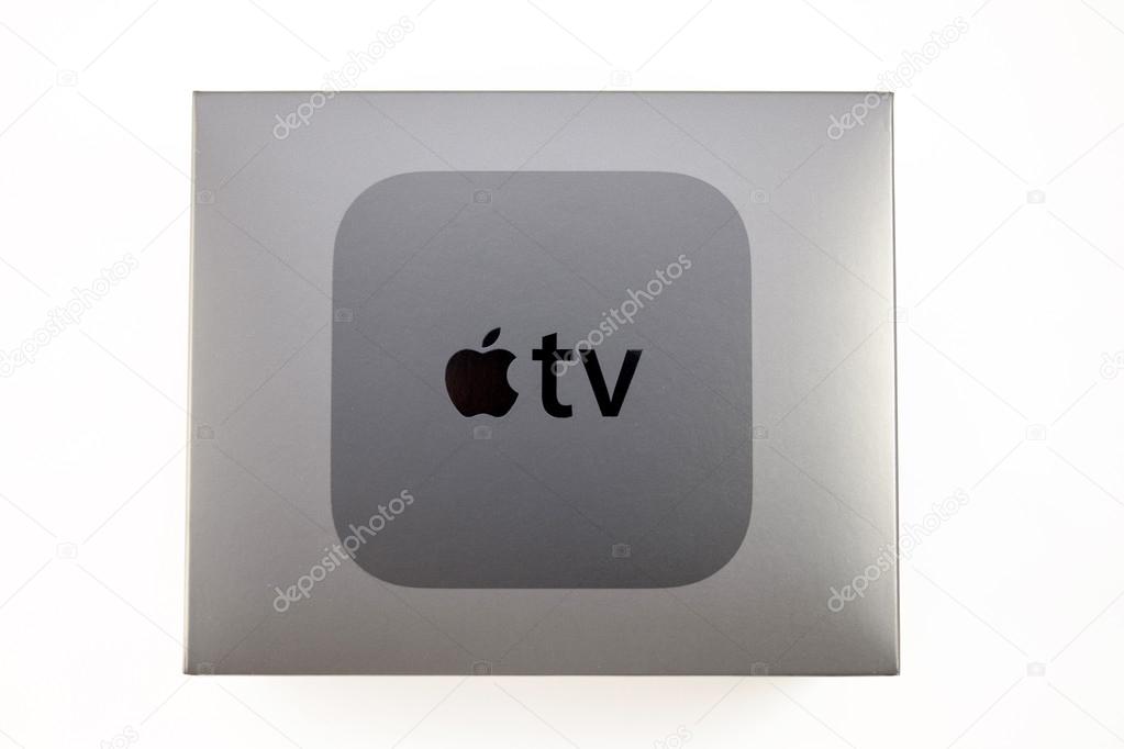 PARIS, FRANCE - NOV 10, 2015: New Apple TV media streaming  player microconsole by Apple Computers - cardboard box with logo.  It has new touch remote swipe-to-select with integrated Siri and motion senso