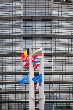 European Union Flags and France flag flies at half-mast clipart