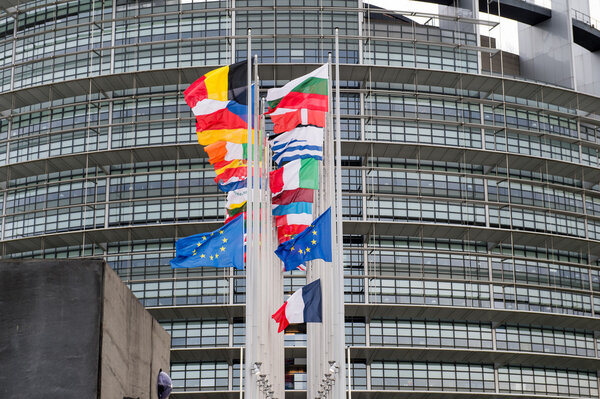 European Union Flags and France flag flies at half-mast