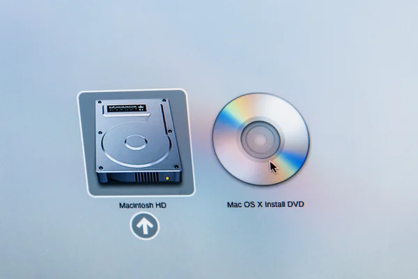 Macintosh Hard disk icon next to DVD Mac OS X install DVD — Stok fotoğraf