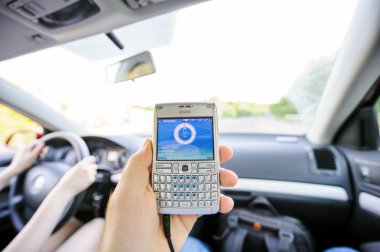 Man cheking speed and direction on GPS screen