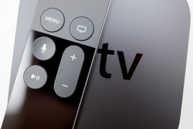 Siri remote over New Apple TV console