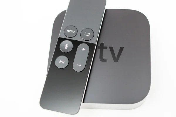 Siri remote over New Apple TV console — Stockfoto