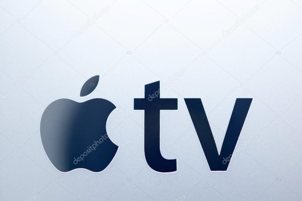 PARIS, FRANCE - NOV 10, 2015: Apple logo on the new Apple TV media streaming  player microconsole by Apple Computers featuring a new touch remote swipe-to-select with integrated Siri and motion senso