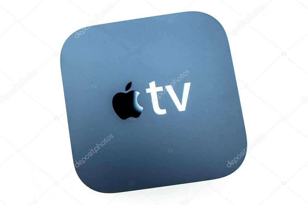 PARIS, FRANCE - NOV 10, 2015: New Apple TV media streaming  player microconsole by Apple Computers - isolated on white. It has new touch remote swipe-to-select with integrated Siri and motion senso