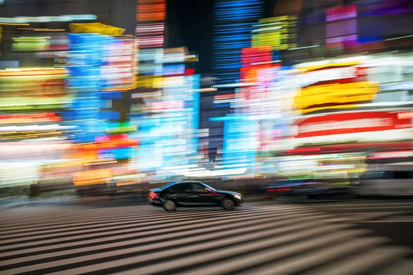 Luces de coche y ciudad en movimiento Imagen de archivo