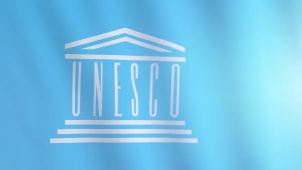 Bandera de las Naciones Unidas para la Educación, la Ciencia y la Cultura. La bandera de la UNESCO ondeando en el viento. Bandera internacional de UNESCO — Vídeos de Stock