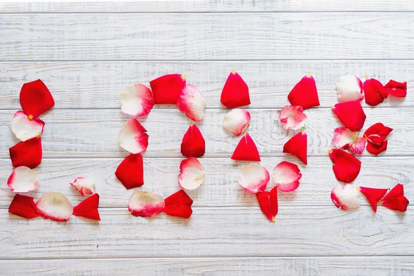 Rose petals love word — Stock Photo, Image