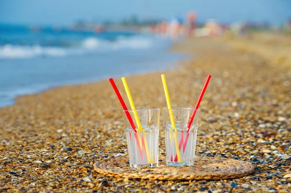 Two glasses on sea beach — Stock Photo, Image