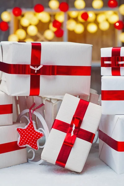 Christmas gift boxes with red ribbon bows — Stock Photo, Image