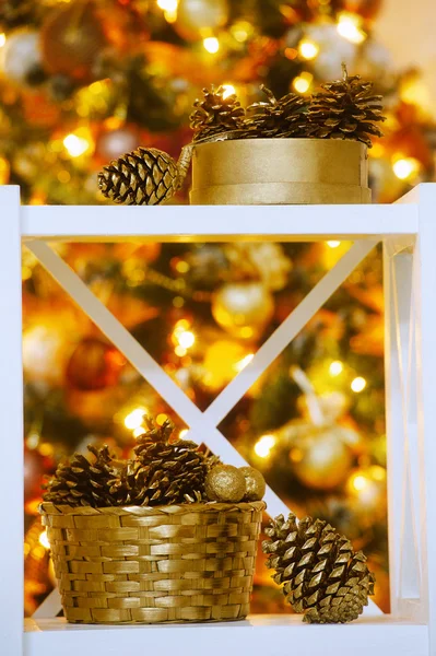 Decorative cones  near Christmas tree — Stock Photo, Image