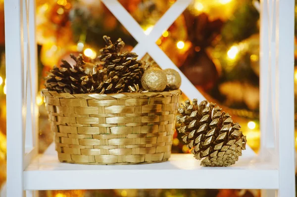 Decorative cones  near Christmas tree — Stock Photo, Image