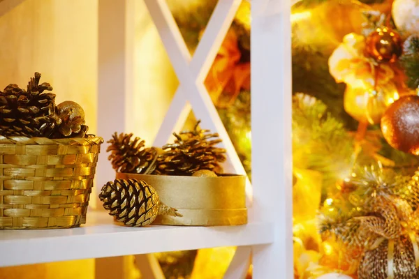 Decorative cones  near Christmas tree — Stock Photo, Image