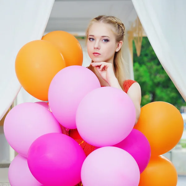 Closeup portrait of tender young woman with balloons — Stock Photo, Image