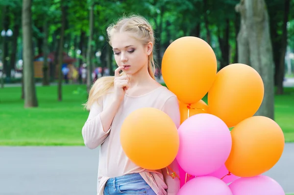 Young woman looking musingly — Stock Photo, Image