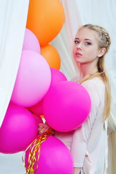 Closeup portrait of tender young woman with balloons — Stock Photo, Image