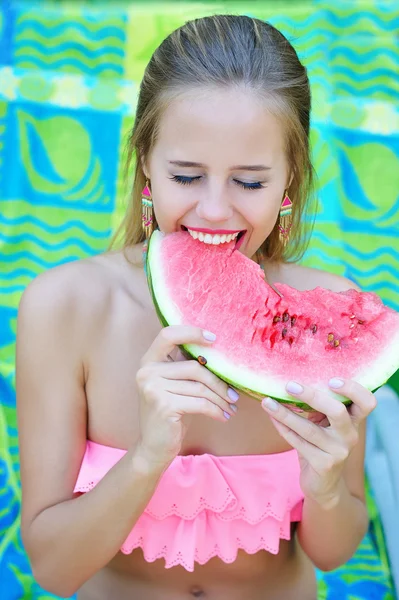 Woman eating watermelon with her eyes closed — Stock Photo, Image