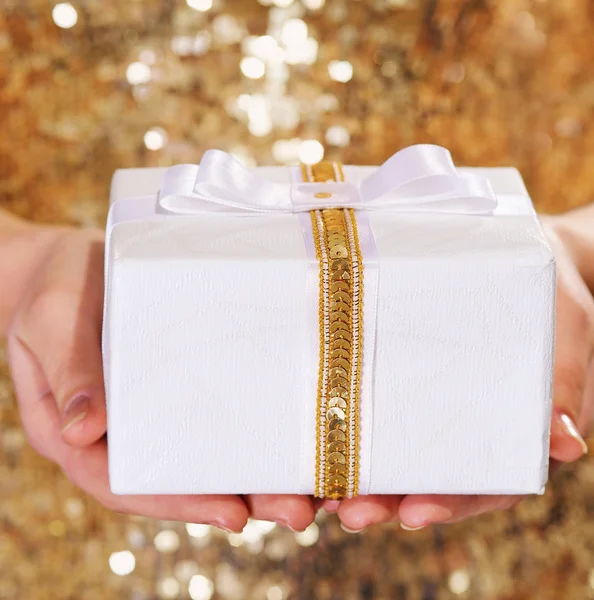 Gift box in woman hands — Stock Photo, Image