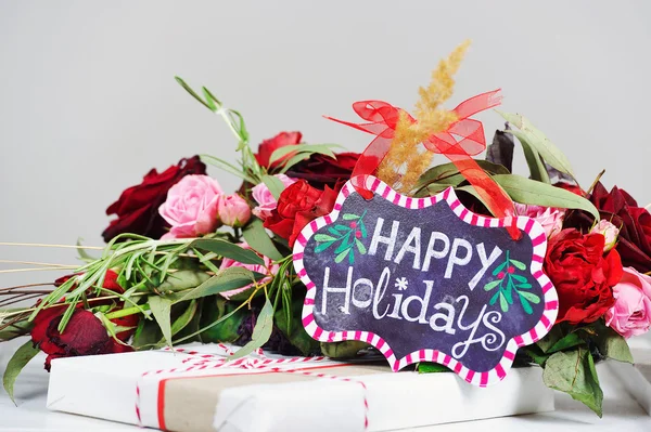 Still life with Happy Holidays sign — Stock Photo, Image