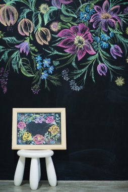 Floral painting on chalk wall clipart