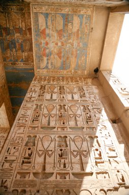 Egyptian paintings and hieroglyphs in temple clipart