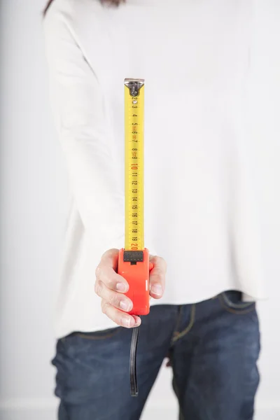 Measure tape in woman hand — Stock Photo, Image