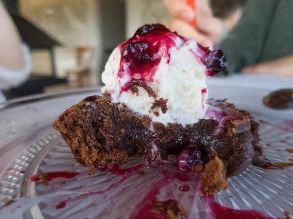 Chocolate cake with ice cream and red fruits jam — Stock Photo, Image